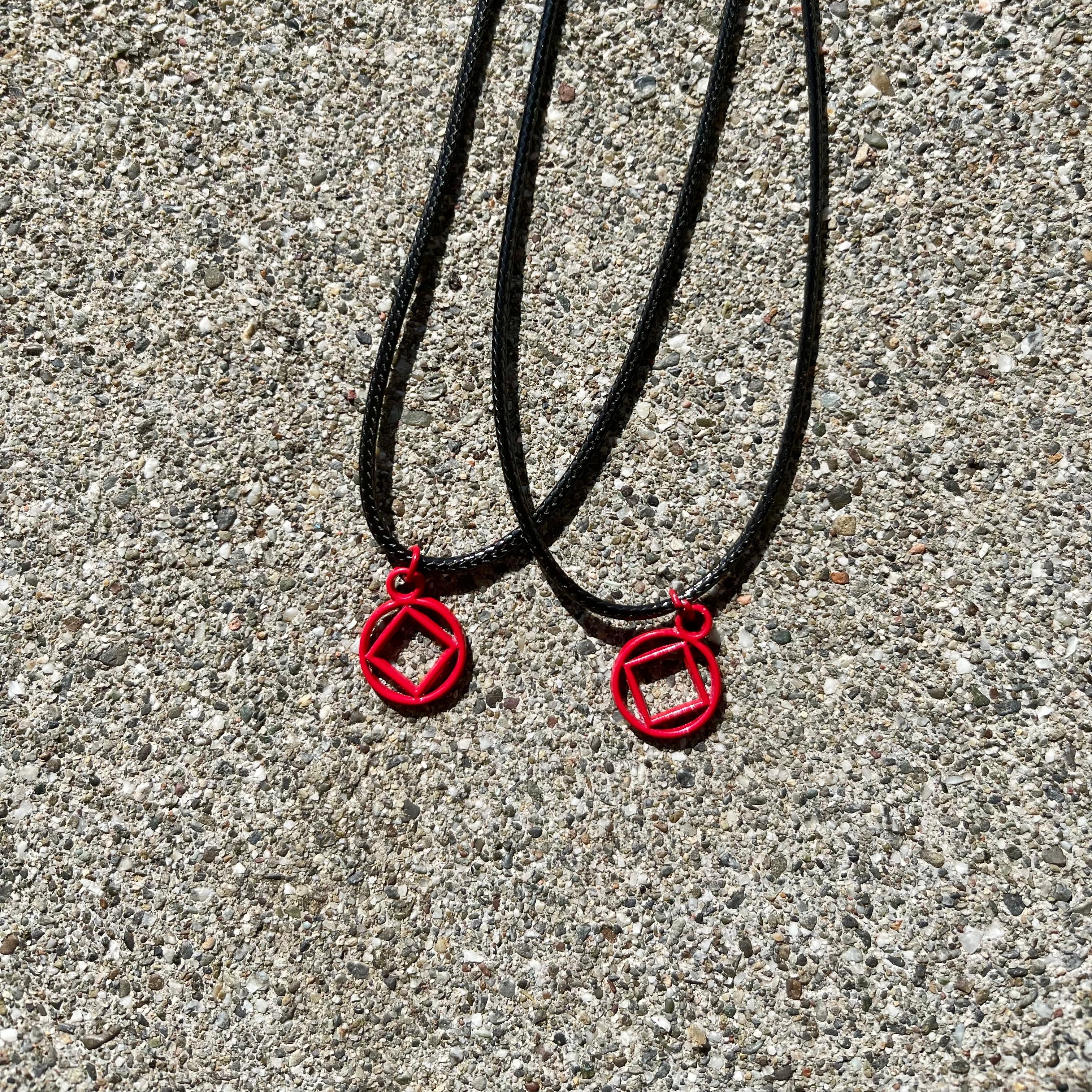 Red Coated NA Charm necklace