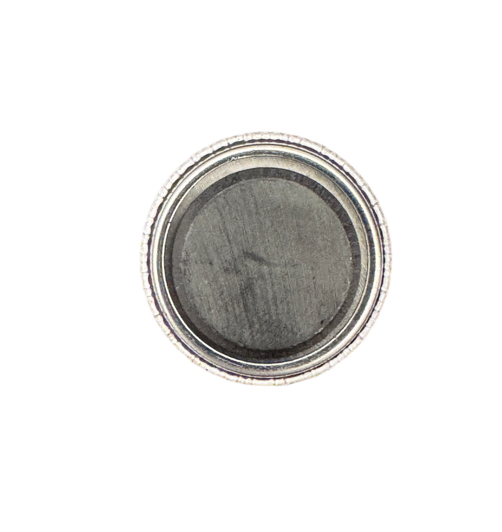 1 inch badge with magnet attached with permanent adhesive on white background 