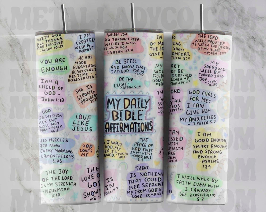 Two tumblers with colorful daily Bible verses affirmations written on them, one with a clear lid and straw, the other without.